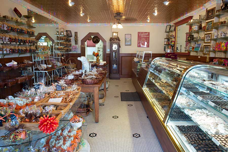 Interior of Vasilow's candy store showing candy showcase